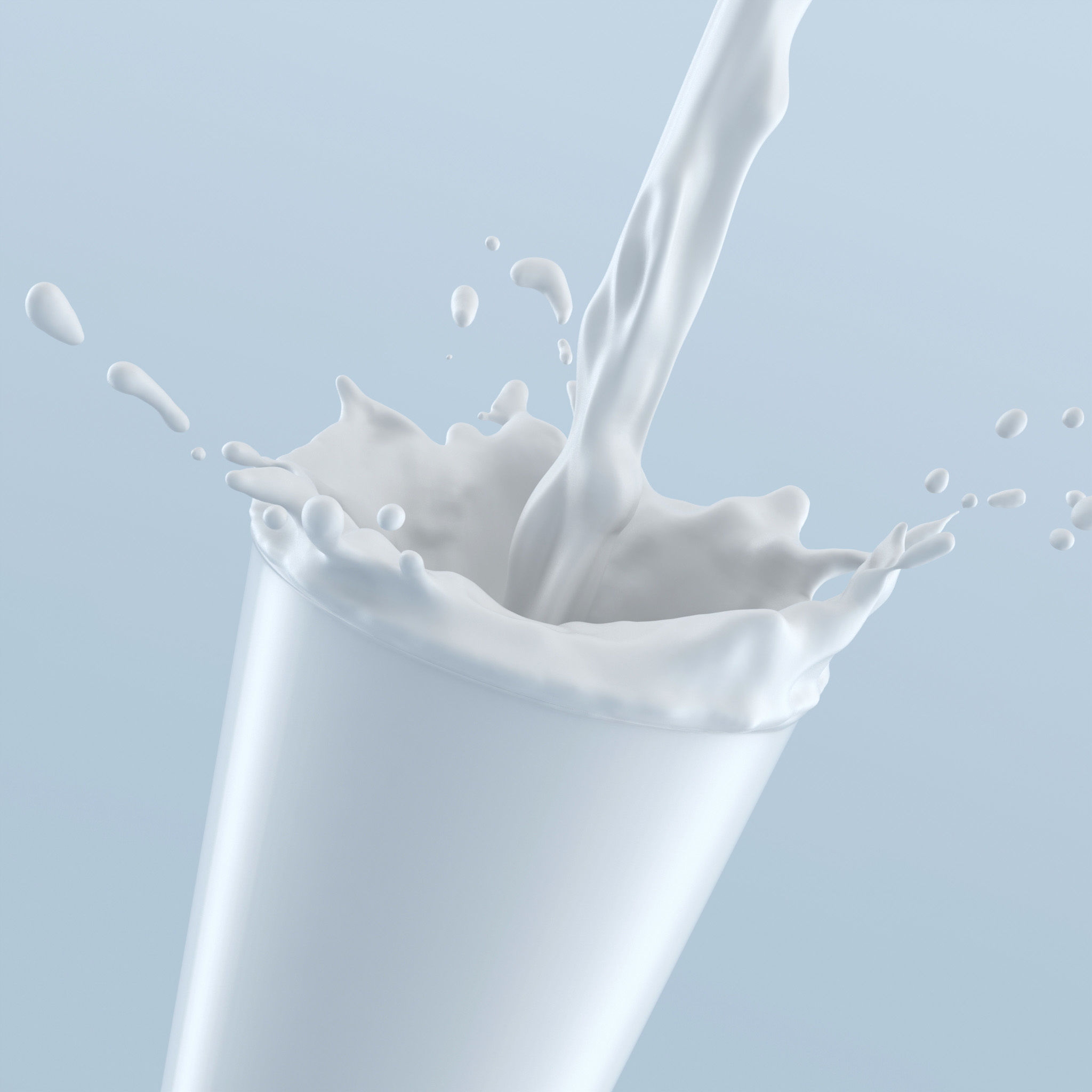 Liquid pouring into glass with splash