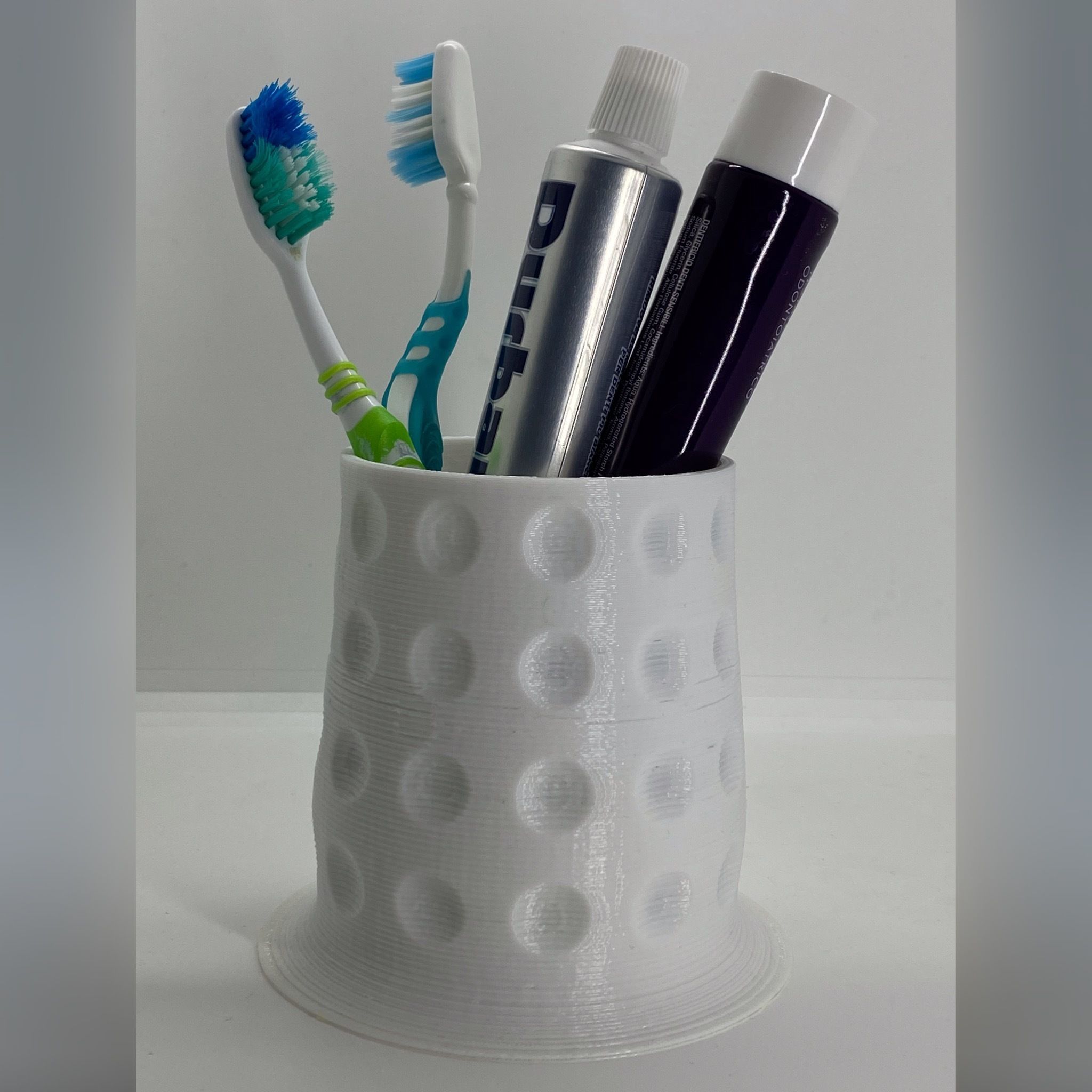 Toothbrush holder with stable base